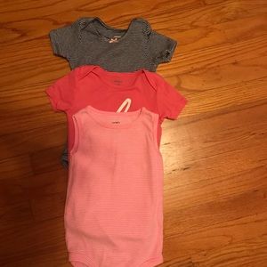 Three adorable Carter’s onesies, size 18 mos.